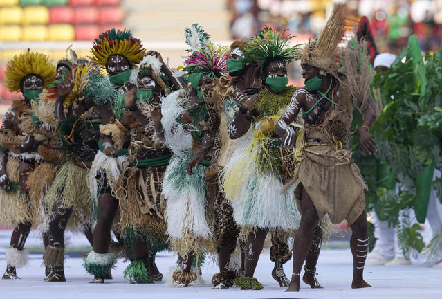 Traditional dancers perform during the opening ceremony of the African Cup of Nations 2022 group A soccer match between Cameroon and Burkina Faso at the Olembe stadium in Yaounde, Cameroon, Sunday, January 9, 2022. (Photo by Themba Hadebe/AP Photo)