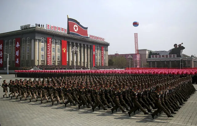 Soldiers march across Kim Il Sung Square during a military parade on Saturday, April 15, 2017, in Pyongyang, North Korea to celebrate the 105th birth anniversary of Kim Il Sung, the country's late founder and grandfather of current ruler Kim Jong Un. (Photo by Wong Maye-E/AP Photo)