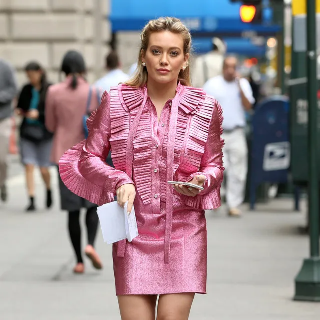 Actress Hilary Duff, wearing a pink ruffled dress, films “Younger” in New York, New York on April 17, 2017. (Photo by Christopher Peterson/Splash News and Pictures)