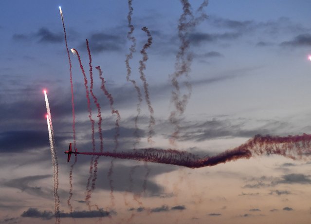 A plane of the Awesome Extra NG aerobatic team performs during the Australian International Airshow Aerospace and Defence Expo at Avalon Airport in Geelong on March 3, 2023. (Photo by Paul Crock/AFP Photo)