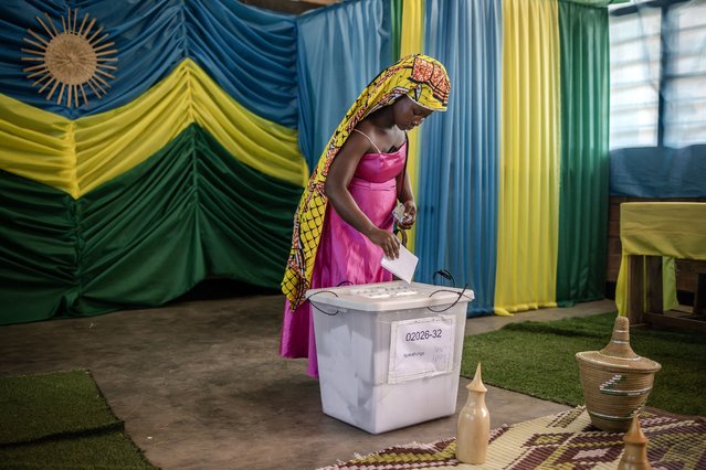 A woman casts her ballot during the 2024 Rwandan general elections at a polling station in Kigali, on July 15, 2024. Millions of Rwandans head to the polls on July 15, 2024 with veteran President Paul Kagame set to cruise to an easy victory over his two approved challengers and extend his iron-fisted rule for another five years. (Photo by Luis Tato/AFP Photo)