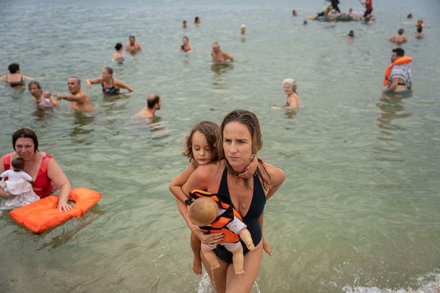 Dozens of activists participate in the international initiative “Swim With Gaza” on the Nova Icaria beach in Barcelona on September 1, 2024. In this edition they have paid tribute to the Gazan swimming team that was training with Amhed Tantish to represent Palestine in the Olympic Games before being bombed and killed. (Photo by Marc Asensio Clupes/ZUMA Press Wire/Rex Features/Shutterstock)