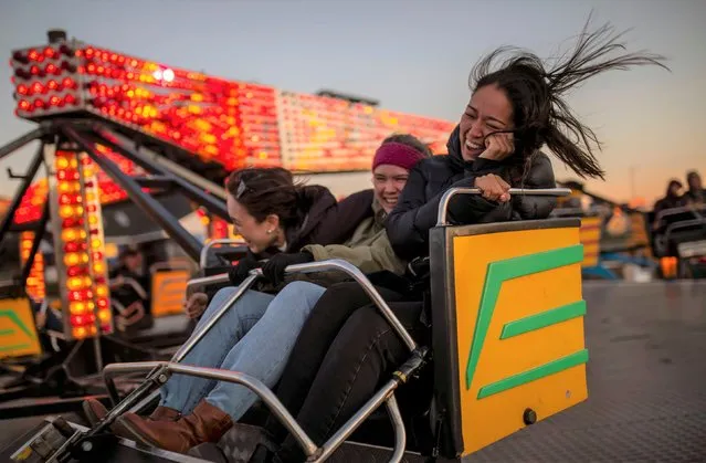 People visit the Tivoli fairground in Nuuk, Greenland, September 5, 2021. (Photo by Hannibal Hanschke/Reuters)