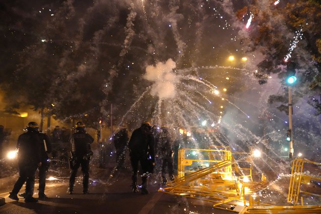 Police forces clash with youths in Nanterre, outside Paris, Thursday, June 29, 2023. The death of 17-year-old Nael by police during a traffic check Tuesday in the Paris suburb of Nanterre elicited nationwide concern and widespread messages of indignation and condolences. Interior Minister Gerald Darmanin said 1,200 police were deployed overnight and 2,000 would be out in force Wednesday in the Paris region and around other big cities to “maintain order”. (Photo by Christophe Ena/AP Photo)