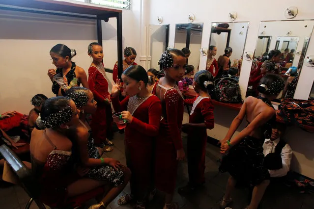 Participants wait for their turn to perform in the World Tango Championship in Medellin, Colombia, June 19, 2016. (Photo by Fredy Builes/Reuters)