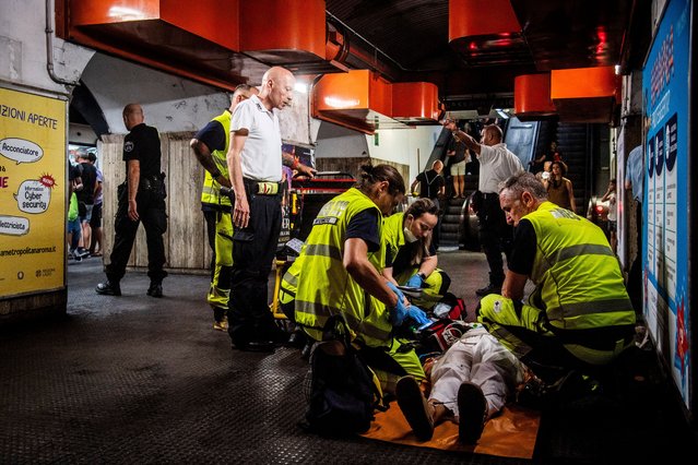 Emergency service staff provide relief for people affected by heat stroke in Rome, Italy on July 18, 2023, as temperatures in Rome hit 41C. (Photo by Alessandro Serranv/Rex Features/Shutterstock)