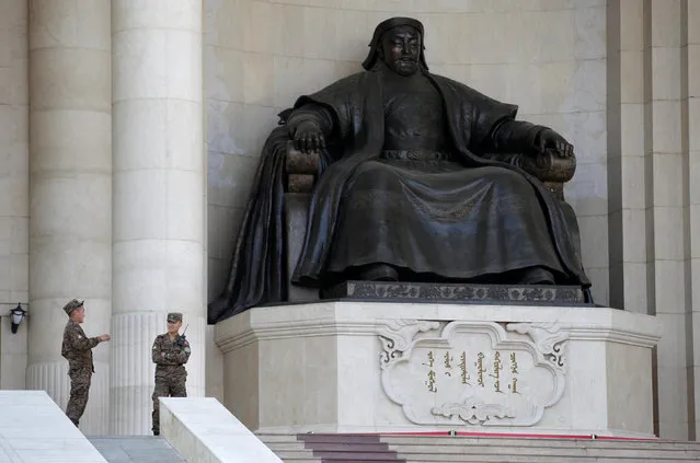 Security personnel chat next to the statue of Genghis Khan at the parliament buildingin Ulaanbaatar, Mongolia, June 27, 2016. (Photo by Jason Lee/Reuters)