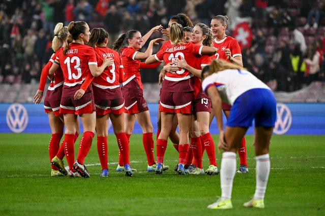 Switzerland's players celebrate their victory at the end of the women's International football friendly match between Switzerland and France, at the Stade de Geneve, in Geneva, on October 29, 2024. (Photo by Fabrice Coffrini/AFP Photo)