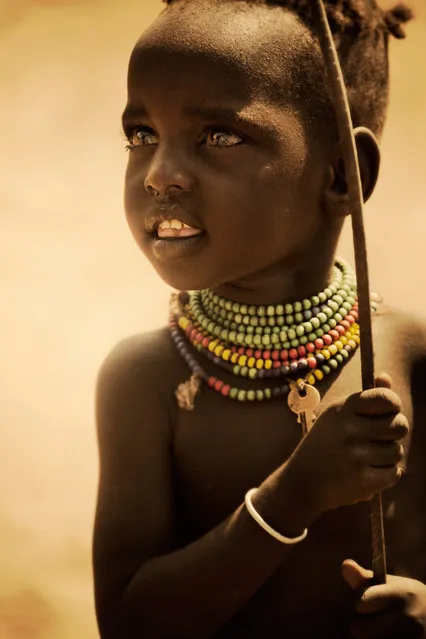 The Hamar tribe practices ritual infanticide. If a child's first tooth appears in the upper jaw, instead of the lower, he or she is “mingi” and considered to be bad luck. The tribe leaves “mingi” children in the desert to die. (Photo by Diego Arroyo)