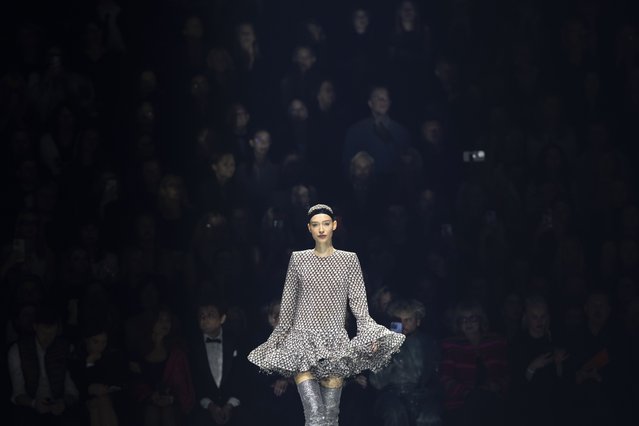 A model presents a creation from the Lithuanian designer Juozas Statkevicius' Haute Couture Spring-Summer 2025 fashion collection in Vilnius, Lithuania, Friday, November 15, 2024. (Photo by Mindaugas Kulbis/AP Photo)