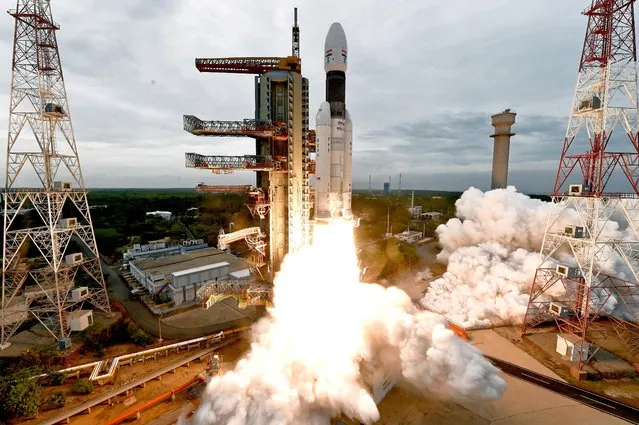 The Indian Space Research Organisation's (ISRO) Chandrayaan-2 (Moon Chariot 2), with on board the Geosynchronous Satellite Launch Vehicle (GSLV-mark III-M1), launches at the Satish Dhawan Space Centre in Sriharikota, an island off the coast of southern Andhra Pradesh state, on July 22, 2019. India launched a bid to become a leading space power on July 22, sending up a rocket to put a craft on the surface of the Moon in what it called a “historic day” for the nation. (Photo by  Indian Space Research Organization via Reuters)