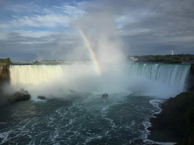 “A permanent rainbow hovers over Niagara Falls and every few minutes a boat takes tourists just to the bottom of the falls as they come crashing down”, wrote Joshua Kaufman, 65, of Chevy Chase, Md., in his submission taken in Canada. (Photo by Joshua Kaufman)