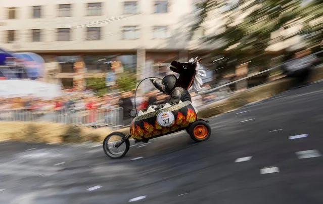 A competitor drives his homemade vehicle without an engine during the Red Bull Soapbox Race in Almaty, Kazakhstan September 24, 2017. (Photo by Shamil Zhumatov/Reuters)