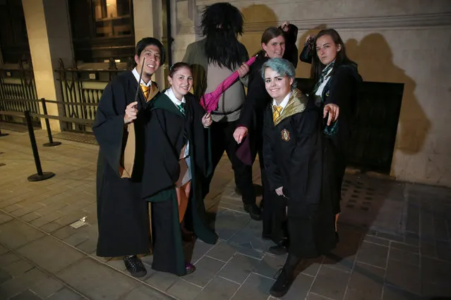 Fans in costume queue at an event to mark the release of the book of the play of Harry Potter and the Cursed Child parts One and Two at a bookstore in London, Britain July 30, 2016. (Photo by Neil Hall/Reuters)