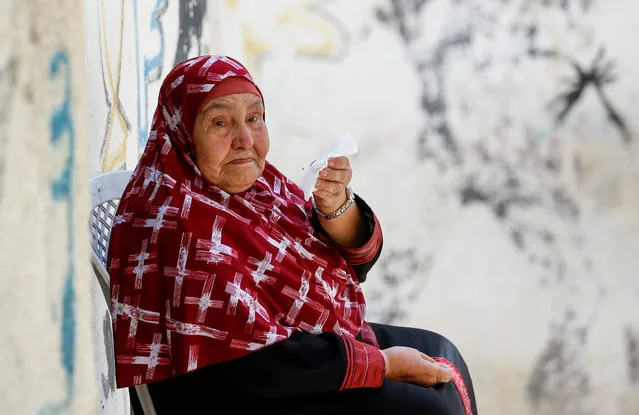 A woman reacts after Palestinian Yazan Afanah was killed during an Israeli raid in Qalandiya, in the Israeli-occupied West Bank on September 1, 2022. (Photo by Mohamad Torokman/Reuters)