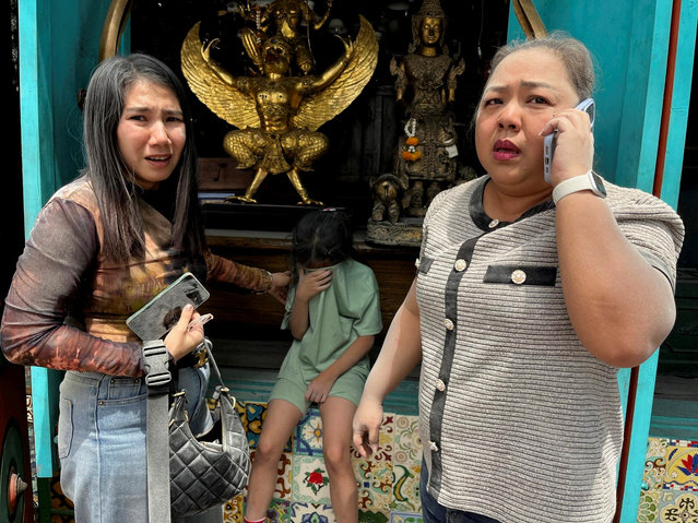 Women and a child react after a strong earthquake struck central Myanmar on Friday, earthquake monitoring services said, which affected Bangkok as well with people pouring out of buildings following the tremors in the Thai capital, in Bangkok, Thailand, on March 28, 2025. (Photo by Ann Wang/Reuters)