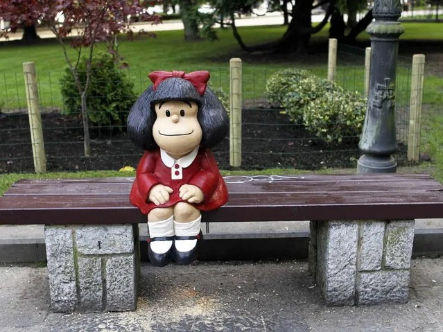 View of a little sculpture (80 centimetres) of cartoon Mafalda created by Argentinian Joaquin Salvador Lavado known as “Quino” displayed at Campo de San Francisco park in Oviedo, Asturias northern Spain, 21 October 2014. “Quino” will receive the 2014 Prince of Asturias of Comunication and Human Arts Award during a ceremony at the Campoamor Theatre in Oviedo on 24 October 2014. (Photo by J. L. Cerejido/EPA)
