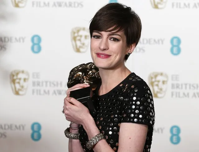 Anne Hathaway celebrates after winning the Best Supporting Actress award for “Les Miserables” at the British Academy of Film and Arts (BAFTA) awards ceremony at the Royal Opera House in London February 10, 2013. (Photo by Suzanne Plunkett/Reuters)