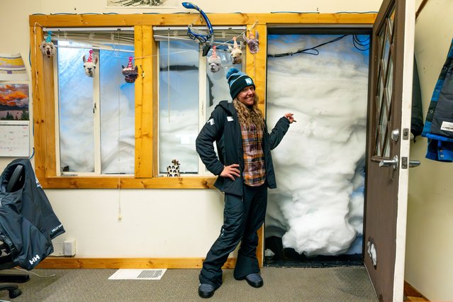 In this photo provided by Sugar Bowl Resort, snow covers the door of the marketing office at the Sugar Bowl Resort in Norden, Calif., on Monday, March 4, 2024. A powerful blizzard dumped more than 10 feet of snow on the California ski resort, where the marketing team had to dig a tunnel to get to their office door. The storm closed highways and most lifts at ski resorts over the weekend. (Photo by Jacob Banta/Sugar Bowl Resort via AP Photo)