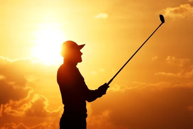 A silhouette of Thorbjorn Olesen of Denmark playing his second shot on the eighteenth hole during day one of the Abu Dhabi HSBC Championship at Yas Links Golf Course on January 19, 2023 in Abu Dhabi, United Arab Emirates. (Photo by Warren Little/Getty Images)