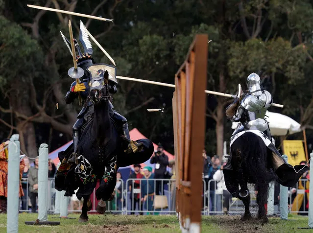 New Zealand's jousting knight Jezz Smith (L) loses grip of his lance after scoring a hit on Australian opponent Cliff Marisma during the final rounds of the jousting competition the St Ives Medieval Fair in Sydney, one of the largest of its kind in Australia, September 25, 2016. (Photo by Jason Reed/Reuters)