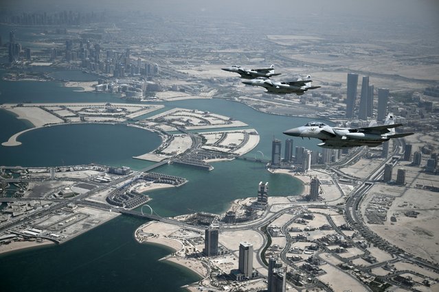 Qatari airforce escorts the plane transporting US President Donald Trump as it prepares to land in Doha from Saudi Arabia on May 14, 2025. Trump touched down at Hamad International Airport in Doha, with relations between the two governments in the spotlight over Qatar's offer to Trump of a $400 million luxury aircraft to serve as a new Air Force One and then pass into his personal use. (Photo by Brendan Smialowski/AFP Photo)