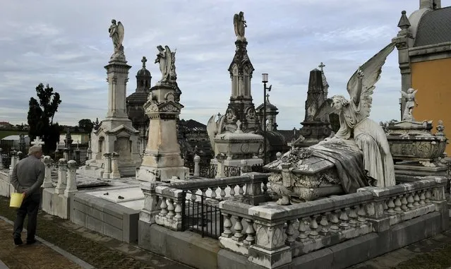 A man looks the pantheon of the Marquesa de San Juan de Nieva, chosen as the best tomb sculpture of Spain in a Spanish magazine this week, in the municipal cemetery of La Carriona in Aviles, northern Spain, October 29, 2015. (Photo by Eloy Alonso/Reuters)