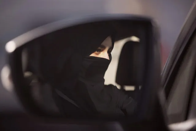 A student at the female-only campus of Effat University, sits for the first time in the driver's seat, during training sponsored by Ford Motor, in Jiddah, Saudi Arabia, Tuesday, March 6, 2018. A stunning royal decree issued last year by King Salman announcing that women would be allowed to drive in 2018 upended one of the most visible forms of discrimination against women in Saudi Arabia. (Photo by Amr Nabil/AP Photo)