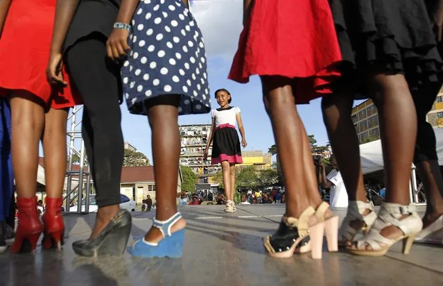 A model catwalks during the Miss Koch beauty and talent pageant titled “Getting to Zero Teenage Pregnancy”, at the Korogocho slums in Nairobi, December 6, 2014. (Photo by Thomas Mukoya/Reuters)