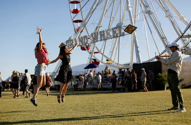 Lindsey and Melissa Gilbert jump as they pose for their dad Allen Gilbert during the Desert Trip music festival at Empire Polo Club in Indio, California, U.S., October 8, 2016. (Photo by Mario Anzuoni/Reuters)