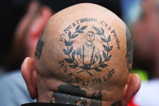 A supporter of British anti-immigration activist Tommy Robinson, with tattoos covering his head attends a rally, in London, on September 13, 2025. (Photo by Chris J. Ratcliffe/Reuters)