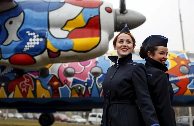 Stewardess pose for picture in front of a painted Antonov-24 plane at Zhulyany airport in Kiev, Ukraine, November 5, 2015. (Photo by Gleb Garanich/Reuters)