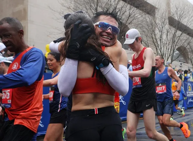 Diego Acosta Toussaint and Alina Ruiz Gonzalez embrace after finishing the the the 127th Boston Marathon in Boston, Massachusetts, U.S. on April 17, 2023. (Photo by Brian Snyder/Reuters)