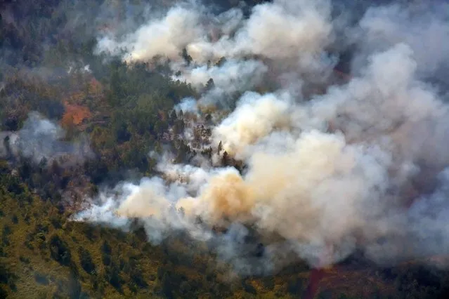 An aerial photograph shows the areas affected by the large-scale forest fire, which today affects the Pinares de Mayari plateau, in the municipality of Mayari, Holguin province, Cuba, 23 February 2023. The large-scale fire has affected more than 600 hectares of that protected natural area, according to preliminary data cited by state media. (Photo by Juan Pablo Carreras Vidal/EPA/EFE)