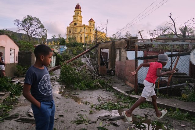Boys walk in El Cobre, Cuba, in the aftermath of Hurricane Melissa on Wednesday, October 29, 2025. (Photo by Ramon Espinosa/AP Photo)