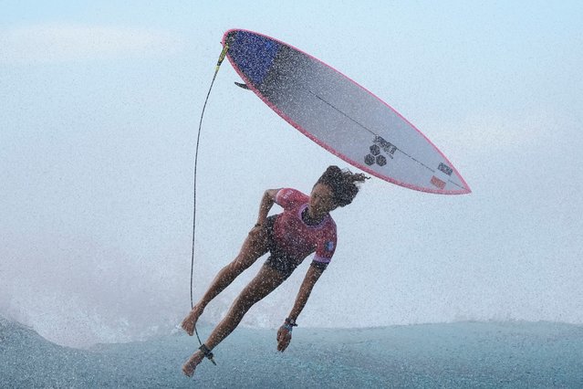 Vahine Fierro, of France, kicks off of a wave during the third round of the 2024 Summer Olympics surfing competition, Thursday, August 1, 2024, in Teahupo'o, Tahiti. (Photo by Gregory Bull/AP Photo)