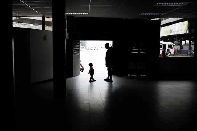 A Venezuelan migrant arriving from Chile talks with her son as they wait to travel to Maracaibo, at the La Bandera bus terminal in Caracas, Venezuela, Sunday, May 7, 2023. (Photo by Matias Delacroix/AP Photo)