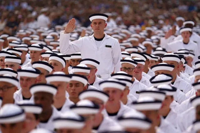 Incoming United States Naval Academy plebes recite the Oath of Office during a ceremony concluding their Induction day at the United States Naval Academy in Annapolis, Maryland, USA, 29 June 2023. Approximately 1200 candidates arrive at the Academy to become midshipmen, also known as plebes, for their first year in the US Navy. (Photo by Will Oliver/EPA)