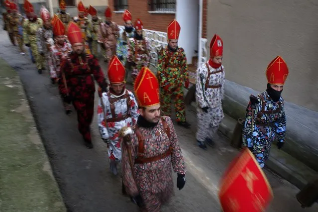 Believers parade around town during the “Endiablada” festival in Almonacid del Marquesado, in central Spain February 3, 2015. (Photo by Susana Vera/Reuters)