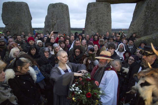 Revellers celebrate the winter solstice at Stonehenge on Salisbury Plain in southern England December 22, 2015. (Photo by Kieran Doherty/Reuters)