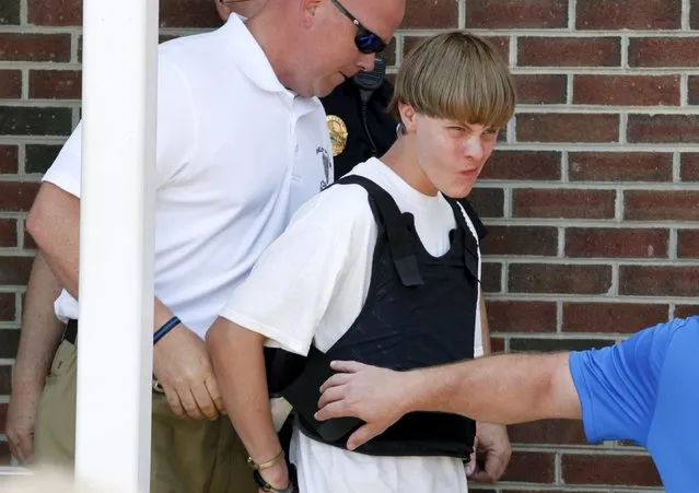 Police lead suspected shooter Dylann Roof, 21, into the courthouse in Shelby, North Carolina, United States June 18, 2015. (Photo by Jason Miczek/Reuters)