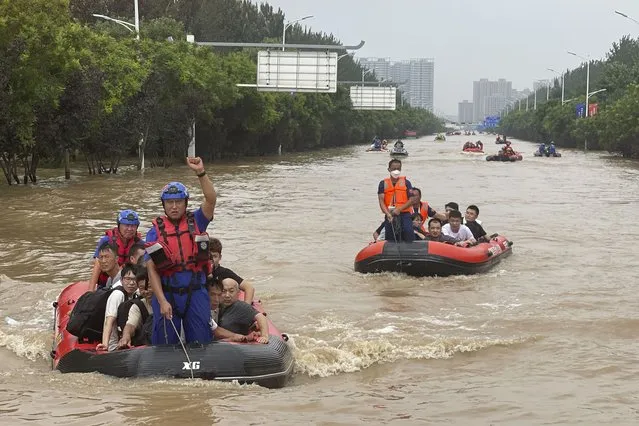 Residents are evacuated by rubber boats through flood waters in Zhuozhou in northern China's Hebei province, south of Beijing, Wednesday, August 2, 2023. China's capital has recorded its heaviest rainfall in at least 140 years over the past few days. Among the hardest hit areas is Zhuozhou, a small city that borders Beijing's southwest. (Photo by Andy Wong/AP Photo)