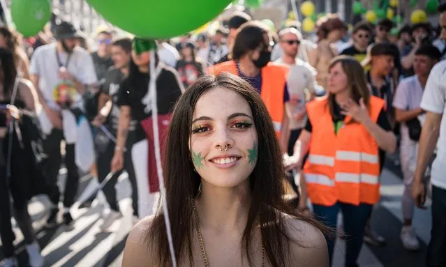 A pro-cannabis protester smiles during a demonstration in the center of Madrid on May 7, 2022. Thousands of pro-cannabis activists took part in a demonstration in La Gran Via in Madrid, Spain, in favor of legalizing the medicinal and recreational use of marijuana. (Photo by Diego Radames/SOPA Images/Rex Features/Shutterstock)