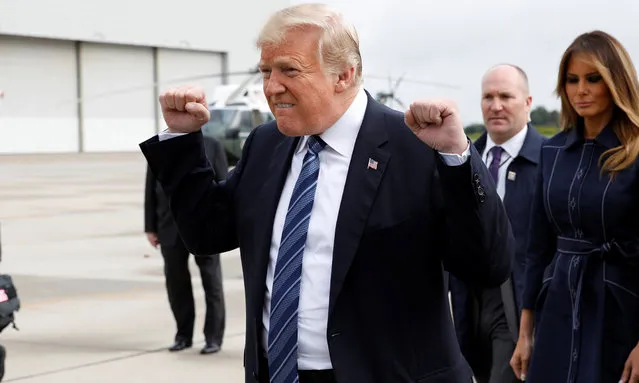 U.S. President Donald Trump gestures after arriving with first lady Melania Trump at John Murtha Johnstown-Cambria County Airport in Johnstown, Pennsylvania, U.S., prior to to taking part in the 17th annual September 11 observance at the Flight 93 National Memorial September 11, 2018. (Photo by Kevin Lamarque/Reuters)