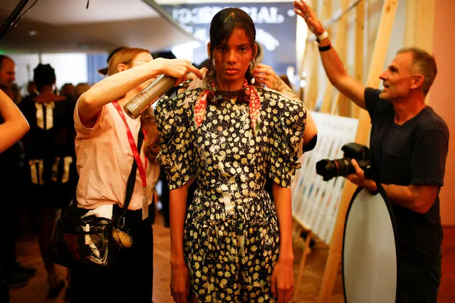 Models prepare backstage of the Preen by Thornton Bregazzi catwalk show at London Fashion Week Women's in London, Britain September 16, 2018. (Photo by Henry Nicholls/Reuters)