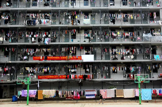 Students of Hubei University of Chinese Medicine hang clothes and quilts on the dormitory balcony on November 24, 2016 in Wuhan, Hubei Province of China. Students of Hubei University of Chinese Medicine air quilts to stay warm in winter. (Photo by VCG/VCG via Getty Images)