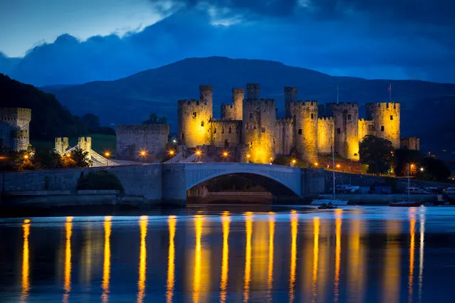 Conwy Castle is lit up in yellow after Geraint Thomas effectively sealed victory in the 2018 Tour de France on Saturday’s penultimate stage in Conwy, UK. Thomas will become the first Welshman to win the bicycle race. (Photo by Cadw/Welsh government/Crown copy/PA Wire)