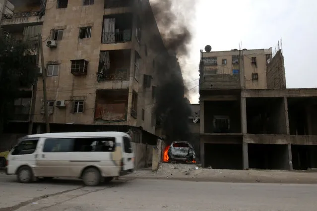 Smoke rises from a car after strikes on the rebel-held besieged al-Zebdieh district, in Aleppo Syria December 5, 2016. (Photo by Abdalrhman Ismail/Reuters)