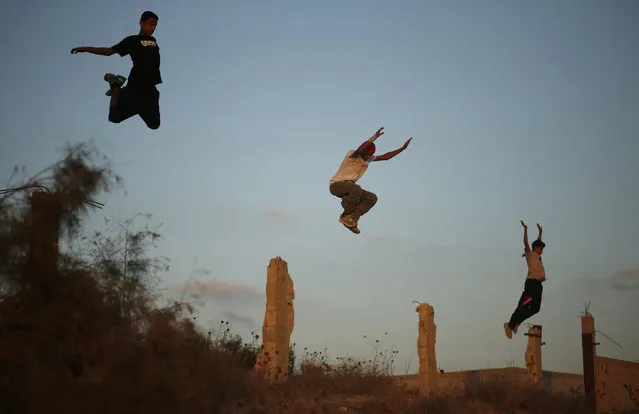 Palestinian youths practice their parkour skills in Khan Younis in the southern Gaza Strip, September 12, 2012. (Photo by Mohammed Salem/Reuters)