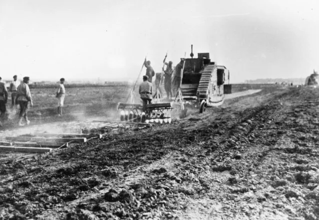 Russian agricultural workers ploughing a field with a captured British tank, after the Civil War decimated technical resources in Russian rural areas, 1921. (Photo by Slava Katamidze Collection/Getty Images)